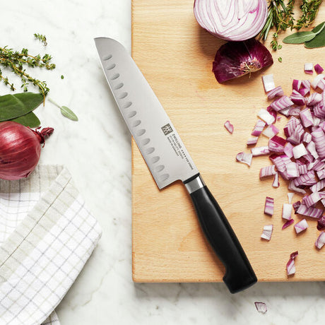 Zwilling Four Star 7-inch Hollow Edge Santoku Knife